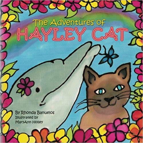 A children's book cover with the protagonist cat and a dolphin