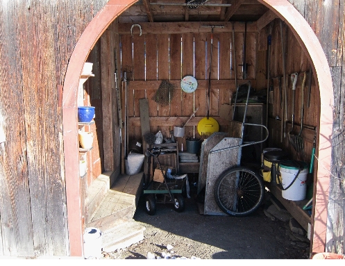 Photo gardening tools in potting shed for winter