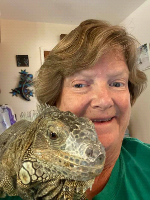 photo Elaine A. Powers and large iguana Calliope