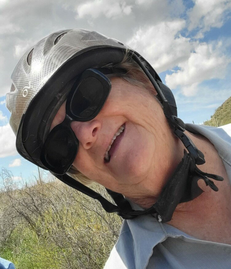 Elaine wearing a riding helmet that looks similar to a bicycle helmet.