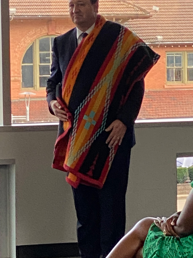 Chief Harper wearing a traditional weaving.