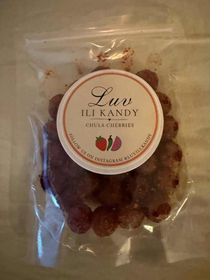 A package of red-coated cherries, the label on the package reads: Luv Ili Kandy, Chula Cherries.