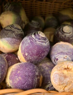 A pile of purple and yellow rutabaga.
